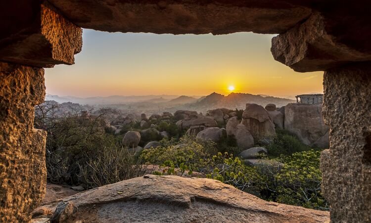 Sunrise in Humpi, state Karnataka, India. Old ancient ruins and Hindu temles.